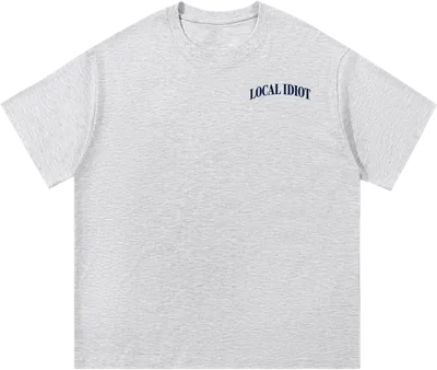 Front: small arched LOCAL IDIOT on the chest
