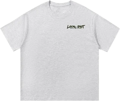 Front: small brush-lettered Local Idiot on the chest